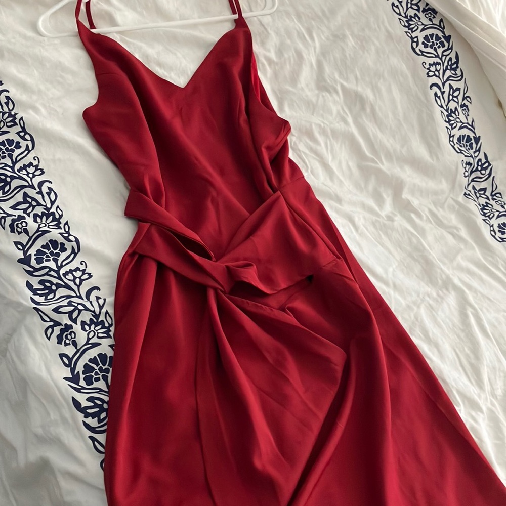 Form fitting red wrap dress with spaghetti straps
